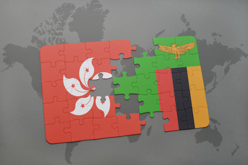 puzzle with the national flag of hong kong and zambia on a world map background.