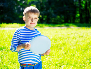 Boy playing frisbee