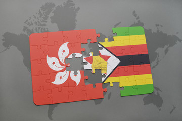 puzzle with the national flag of hong kong and zimbabwe on a world map background.