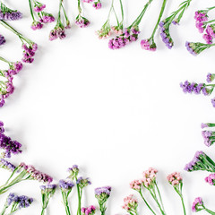 frame with dried flowers on white background. autumn flat lay wallpaper, top view