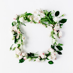 round frame wreath pattern with roses, pink flower buds, branches and leaves isolated on white background. flat lay, top view