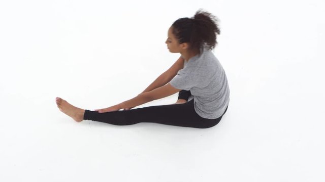 Young African American woman stretching