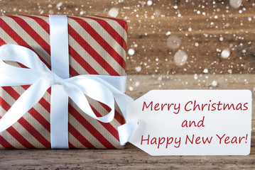 Fototapeta na wymiar Present With Snowflakes, Text Merry Christmas And New Year