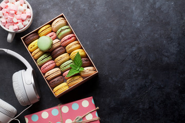 Colorful macaroons in a box and marshmallow