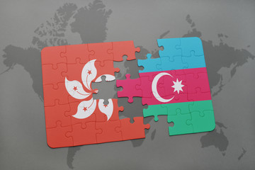 puzzle with the national flag of hong kong and azerbaijan on a world map background.