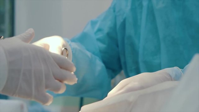electrosurgery tool in surgeon's hand