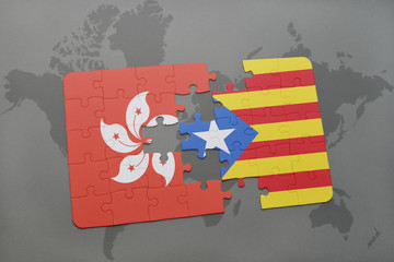 puzzle with the national flag of hong kong and catalonia on a world map background.