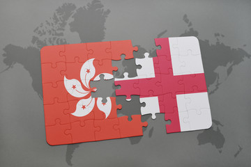 puzzle with the national flag of hong kong and england on a world map background.