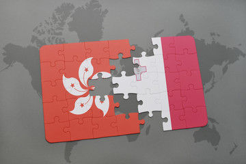 puzzle with the national flag of hong kong and malta on a world map background.