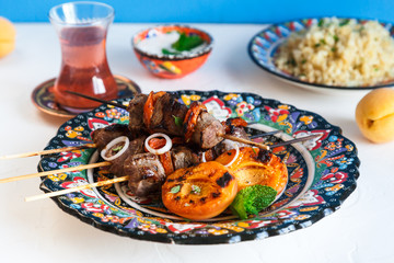 Lamb kebab with dried apricot, bulgur and rose tea