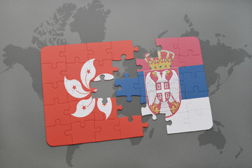 puzzle with the national flag of hong kong and serbia on a world map background.