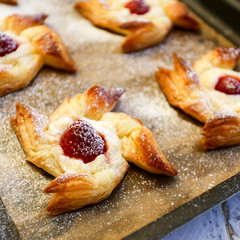 Danish puff pastry pinwheels with vanilla pastry cream and raspb