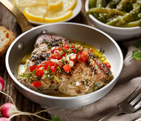 Roasted tuna steak with the addition of tomato salsa