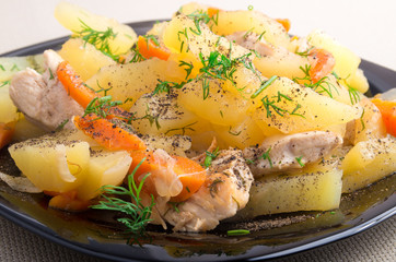 Dish of stewed potatoes with chicken and spices