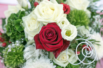 Bridal bouquet with white and red roses