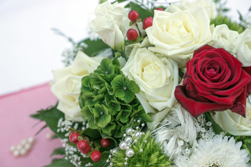 Bridal bouquet with white and red roses