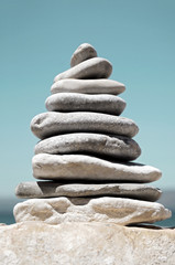 Fototapeta na wymiar Stack of Sea Pebbles in the Shape of Tree or Pyramid
