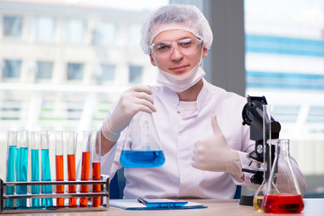 Man working in the chemical lab on science project