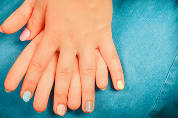 Woman hands with color nail polish. Manicure.