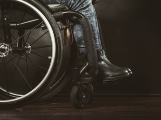 Legs of disabled person.