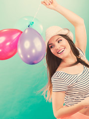 Joyful girl have fun with colorful balloons.