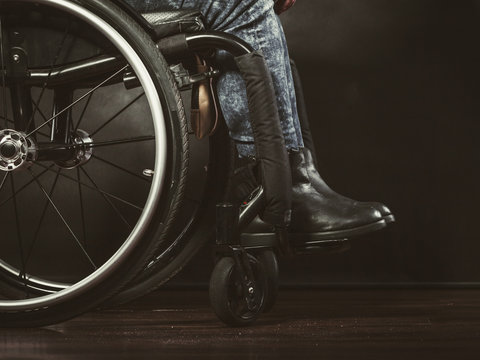 Legs of disabled person.