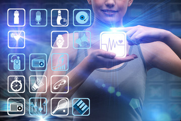 Young girl in sports concept pressing virtual buttons