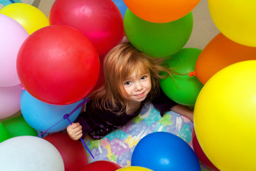 Fototapeta na wymiar Little Girl Under Balloons
