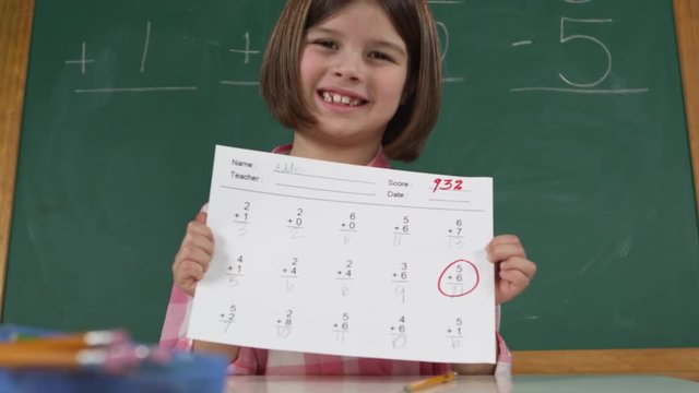 potrait of young girl completing her test