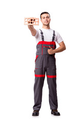 Young worker with brick isolated on white