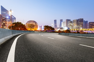Fototapeta na wymiar new asphalt road and the beautiful Cityscape in hangzhou