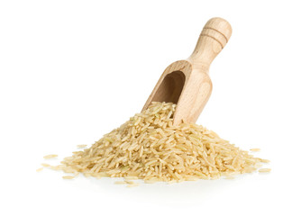 Natural brown uncooked rice in wooden scoop
