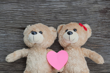 teddy bear lying on the wooden floor