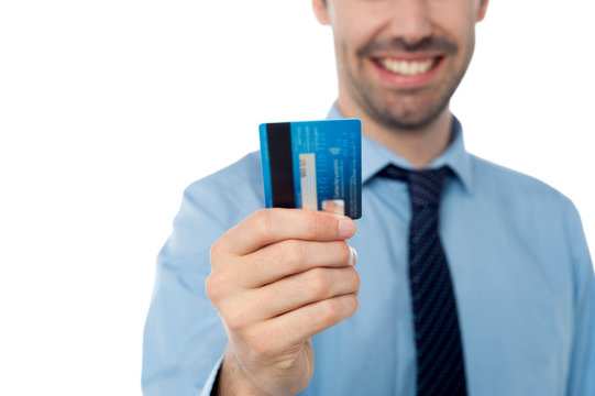 Man holding debit card, cropped image.