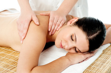 Fototapeta na wymiar Beautiful young woman getting spa massage