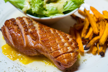 Grilled smoked duck with yellow Mango sauce eat with green salad and sweet potato fries