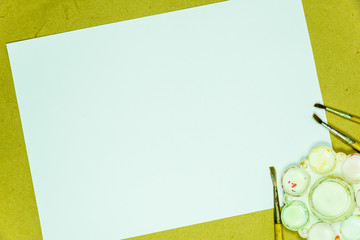 Blank white paper copy space on old brown paper with paintbrush,