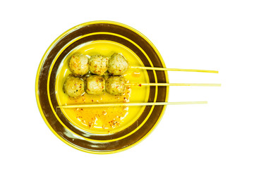 Closeup meatballs on brown dish isolated