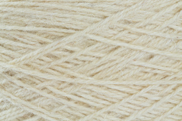 close up of wool thread bobbin