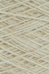 close up of wool thread bobbin