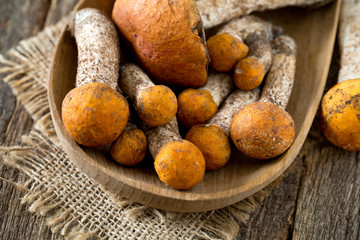 orange-cap boletus on wooden surface