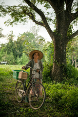 Grandmother on bikes at the country side