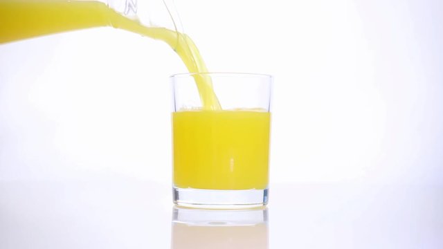 Glass of orange juice. With orange fruit