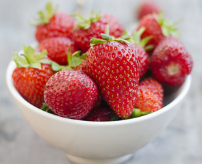 Ripe red strawberries on wooden table