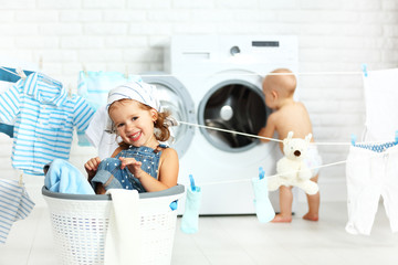 little helpers funny kids happy sister and brother in laundry to