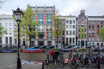Fototapeta premium Beautiful view of canals with bicycle in Amsterdam