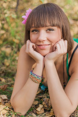 Beautiful girl in autumn park