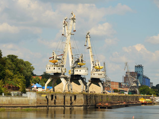 Fototapeta premium A cargo cranes in the port.