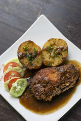 cordon bleu breaded fried chicken gravy and potatoes meal
