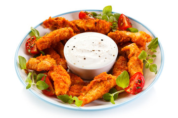 Fried chicken nuggets and vegetables